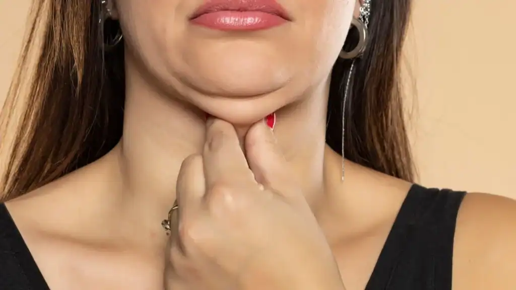 An image of a woman with double chin, sad, worried : Non Surgical Double Chin Removal Treatment in Teddington, UK